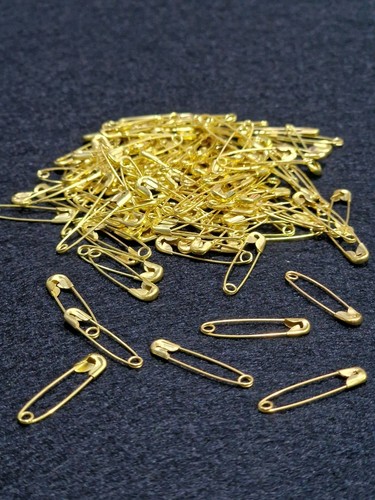 Small gold safety pins - safety,